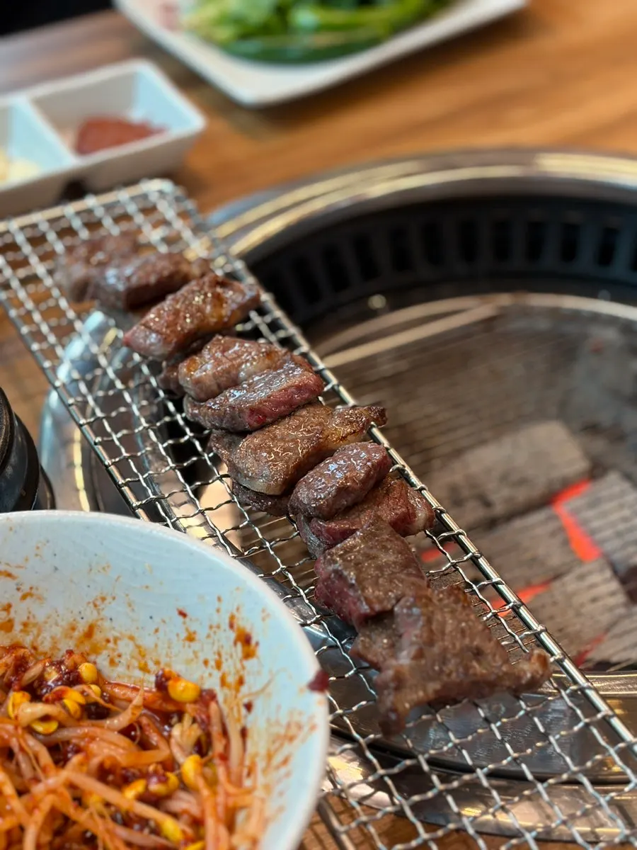 A piece of raw short rib grilled by the staff