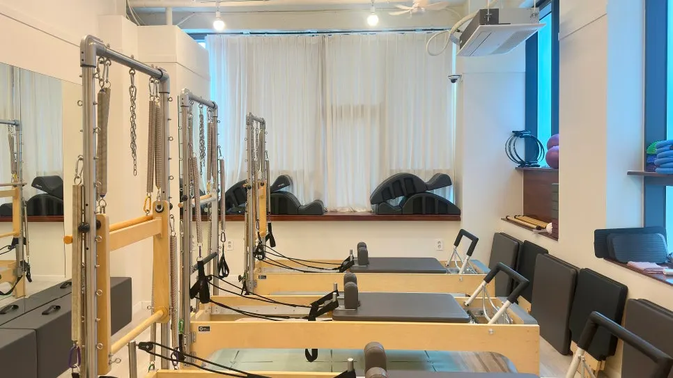Focusing on the instructor's cueing during a Pilates equipment class