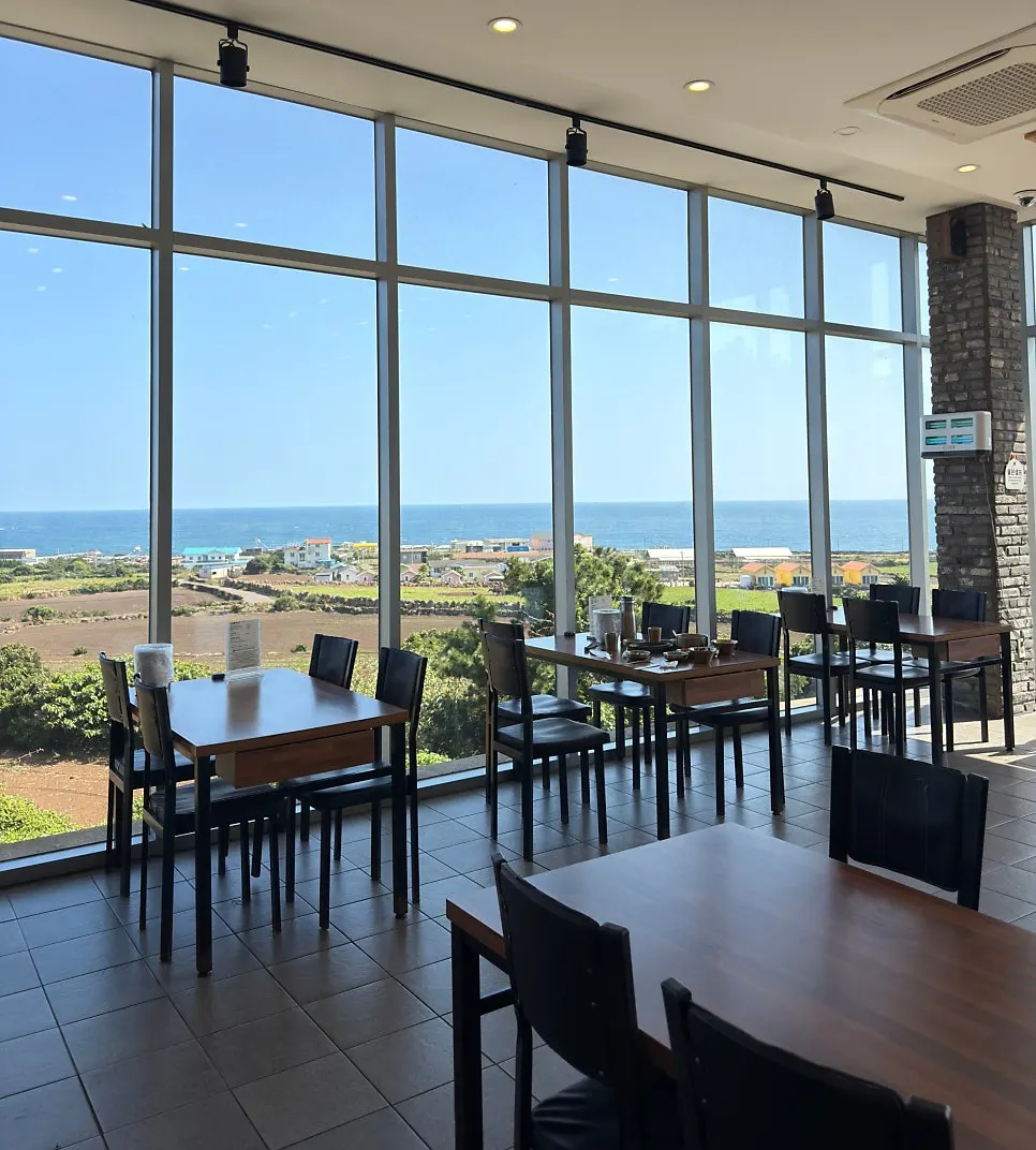 Restaurant interior with wide floor-to-ceiling windows