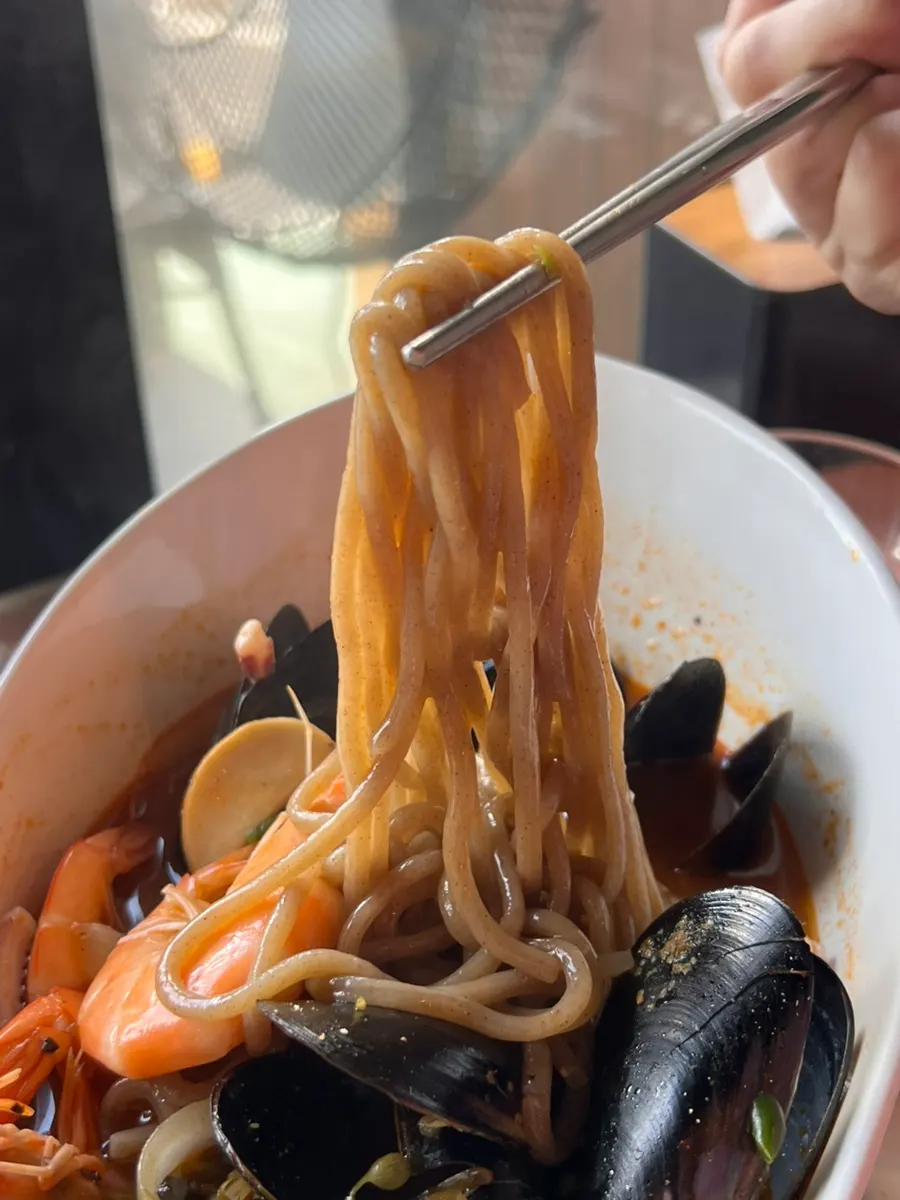 Spicy ujjam broth and noodles
