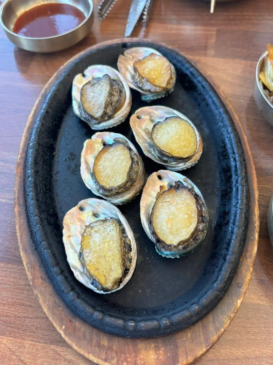 Plate of buttery abalone butter grill