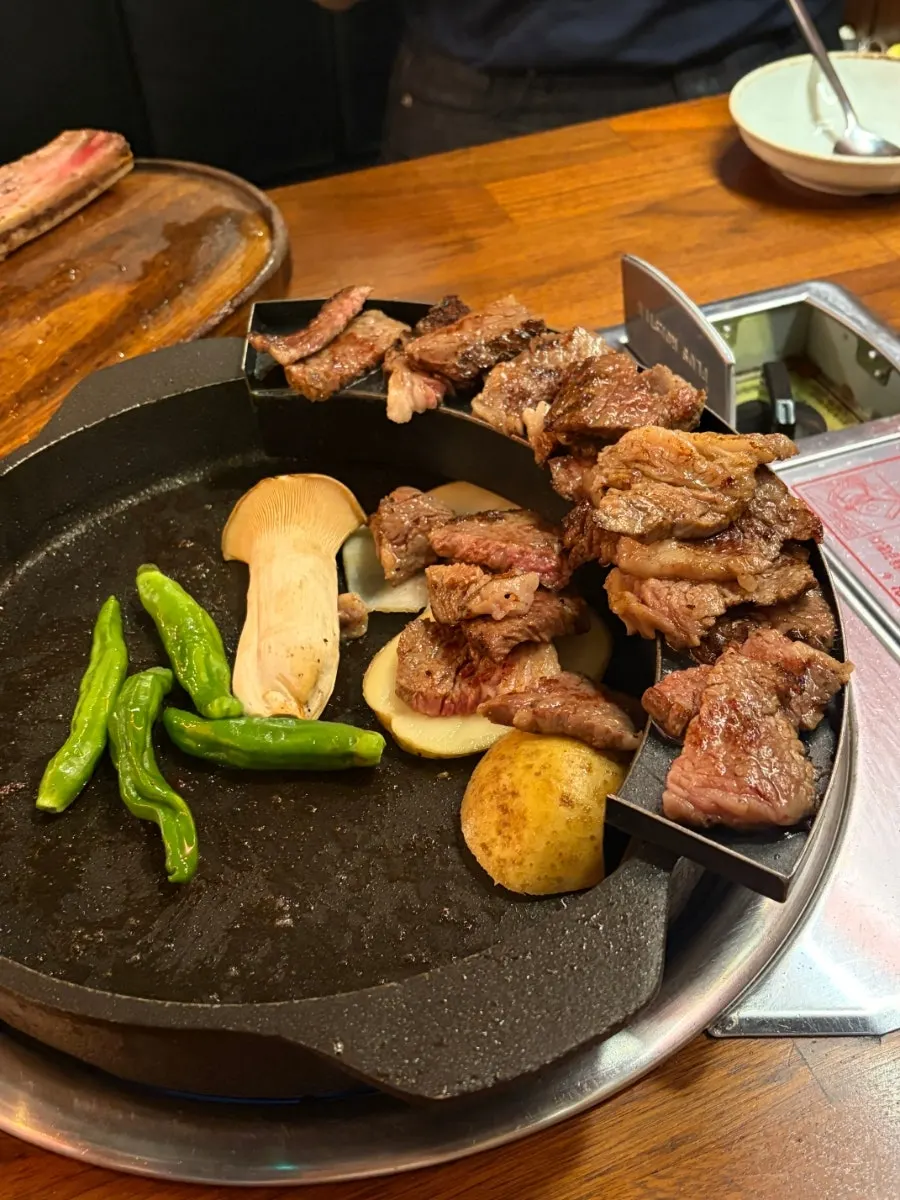 A grilled piece of woodae galbi