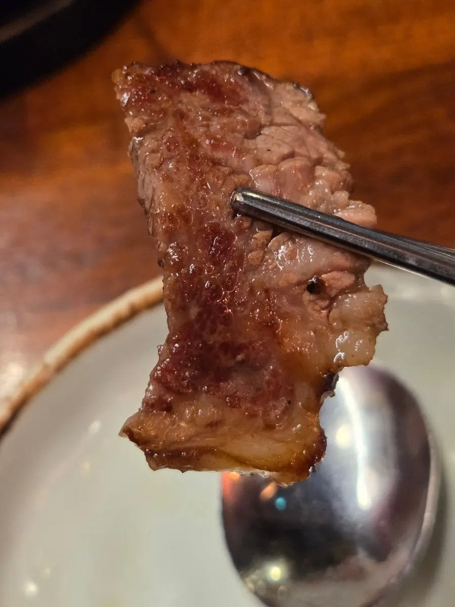 Woodae galbi dipped in salt sauce