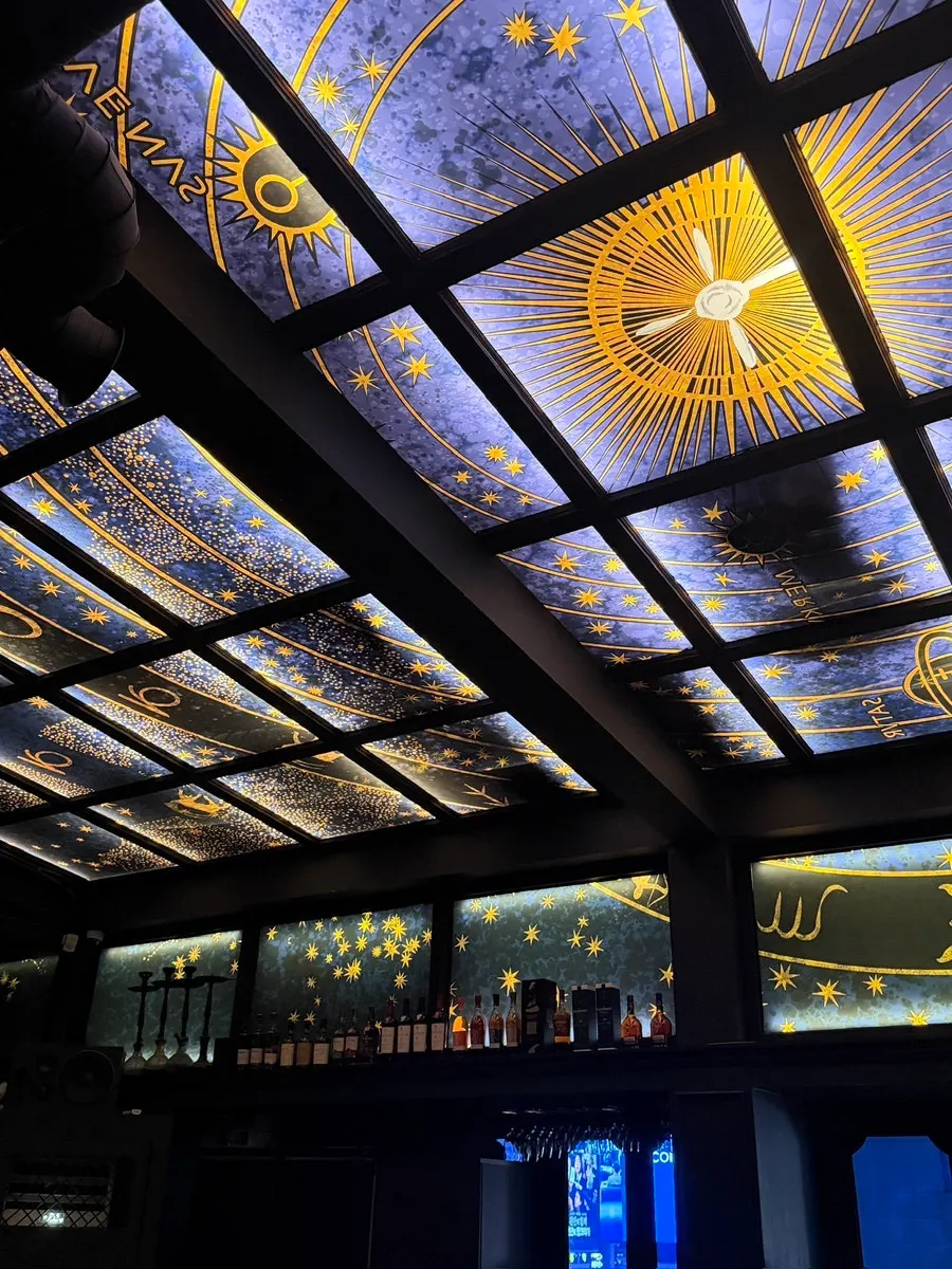 Ugly's indoor space with medieval-style lighting