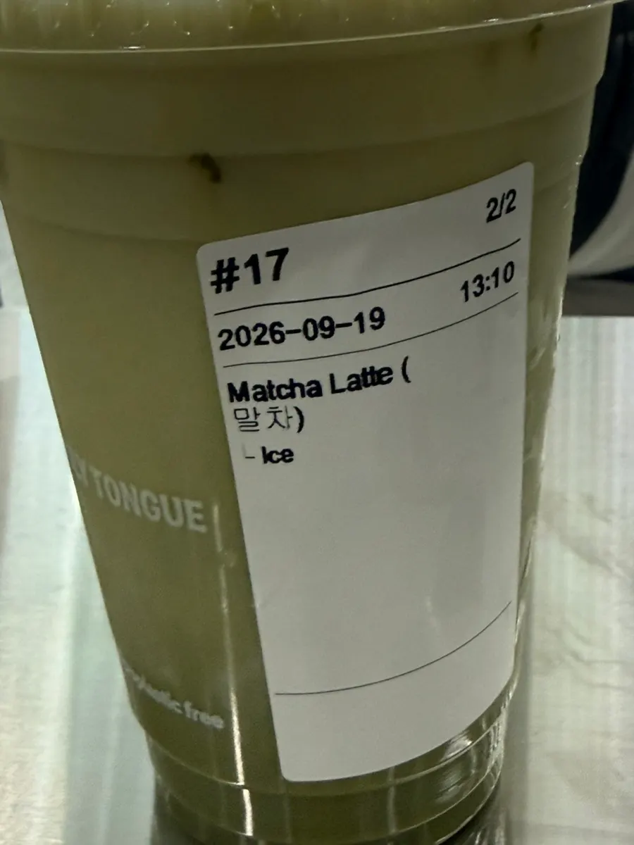 Close-up of the smooth green-colored matcha latte