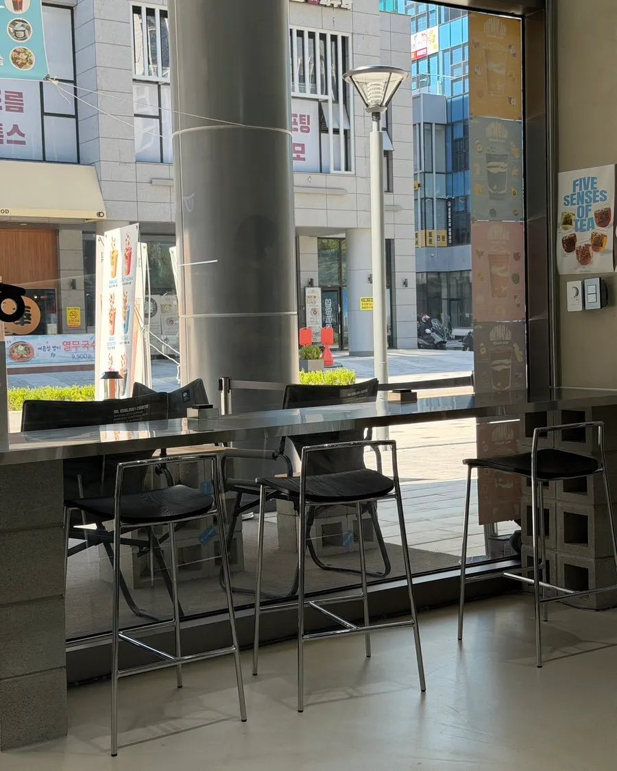Long window table and chairs at Ugly Tongue