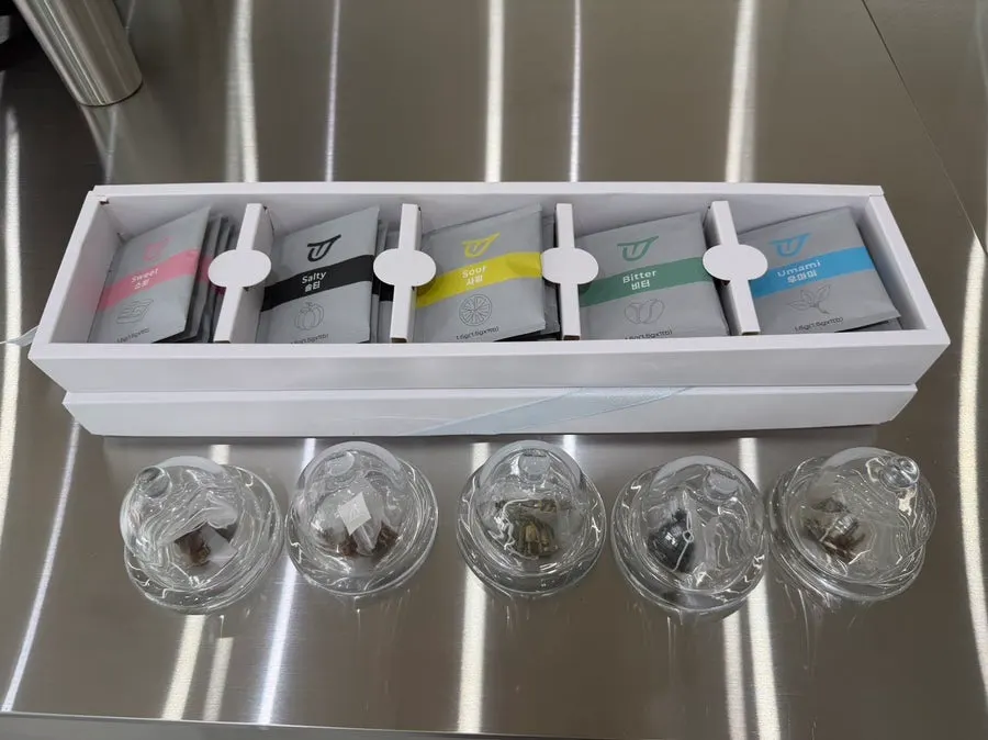 Ugly Tongue tea bags and tea samples in glass containers