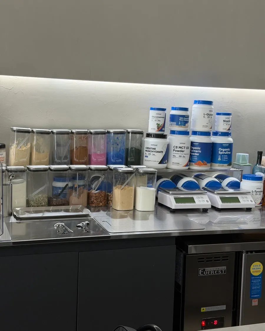 Preparation counter with ingredient containers, powders, and digital scale