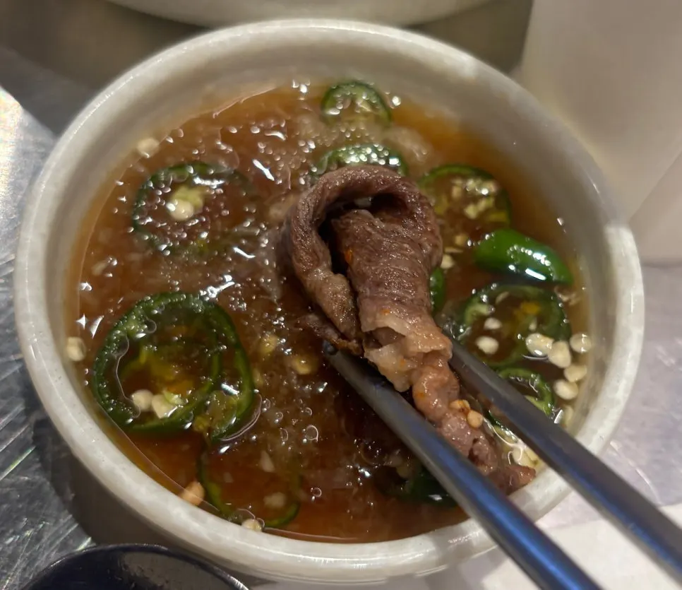 Close-up of a bite of beef brisket samhap