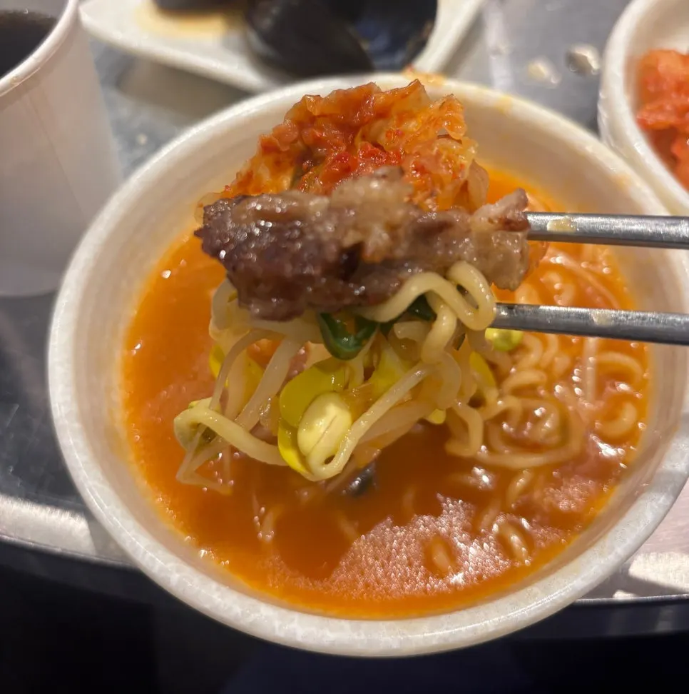 Close-up of the Hong Kong ramyeon broth and noodles