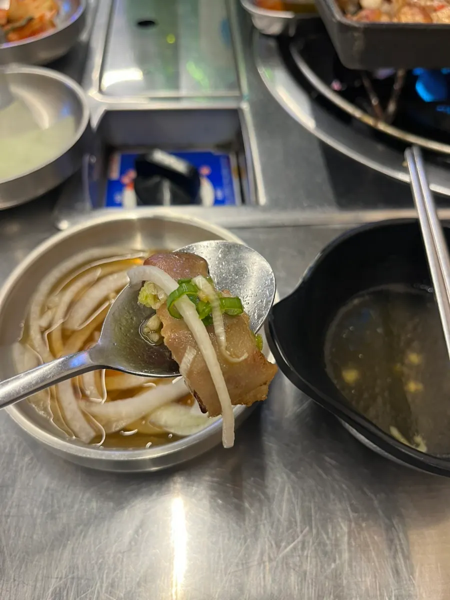 A piece of gopchang with chives