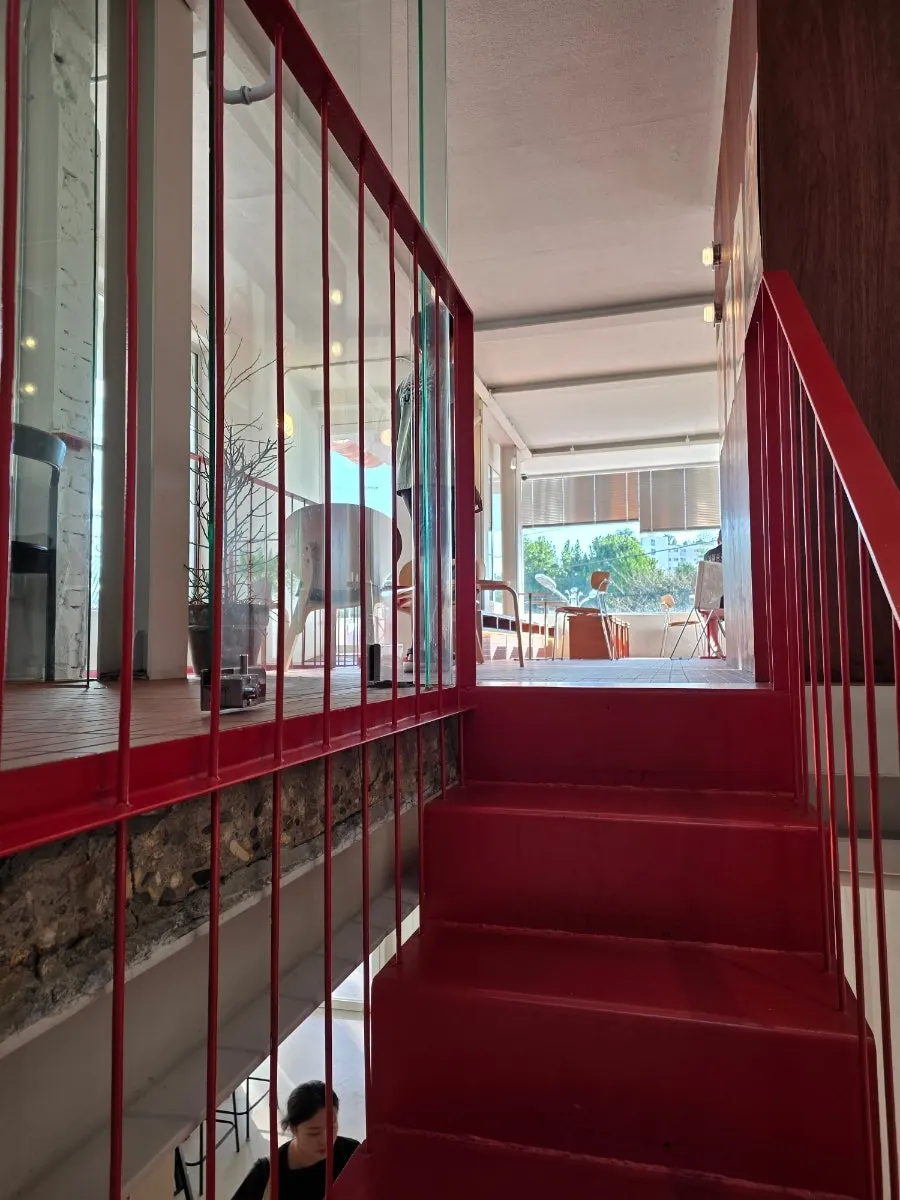 Red staircase and second-floor space