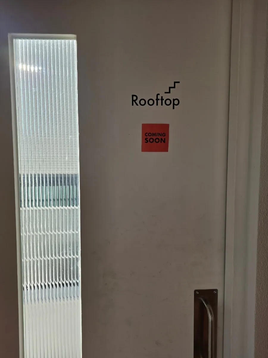 Rooftop with a coming-soon notice