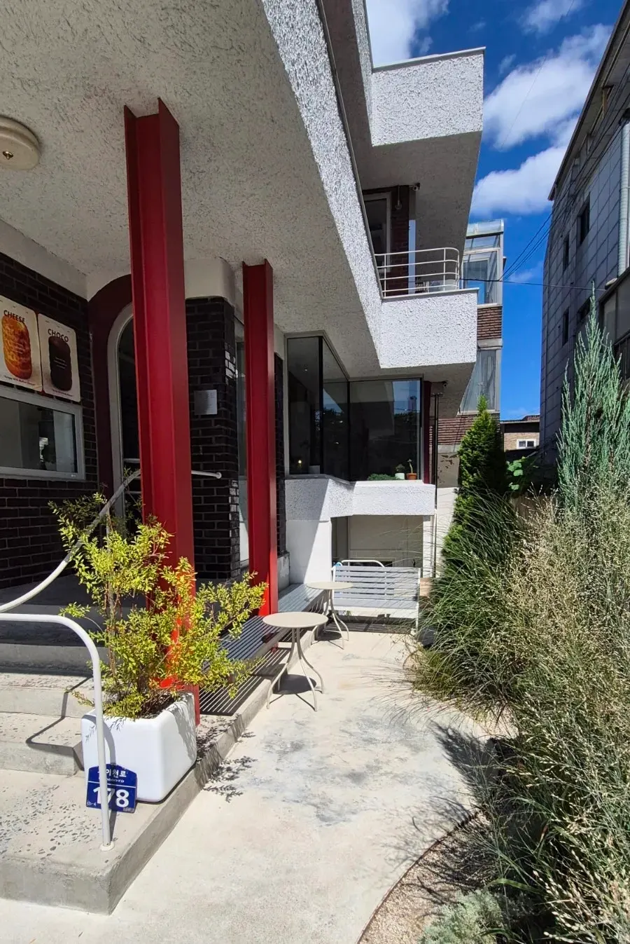 Café entrance with plants and pots