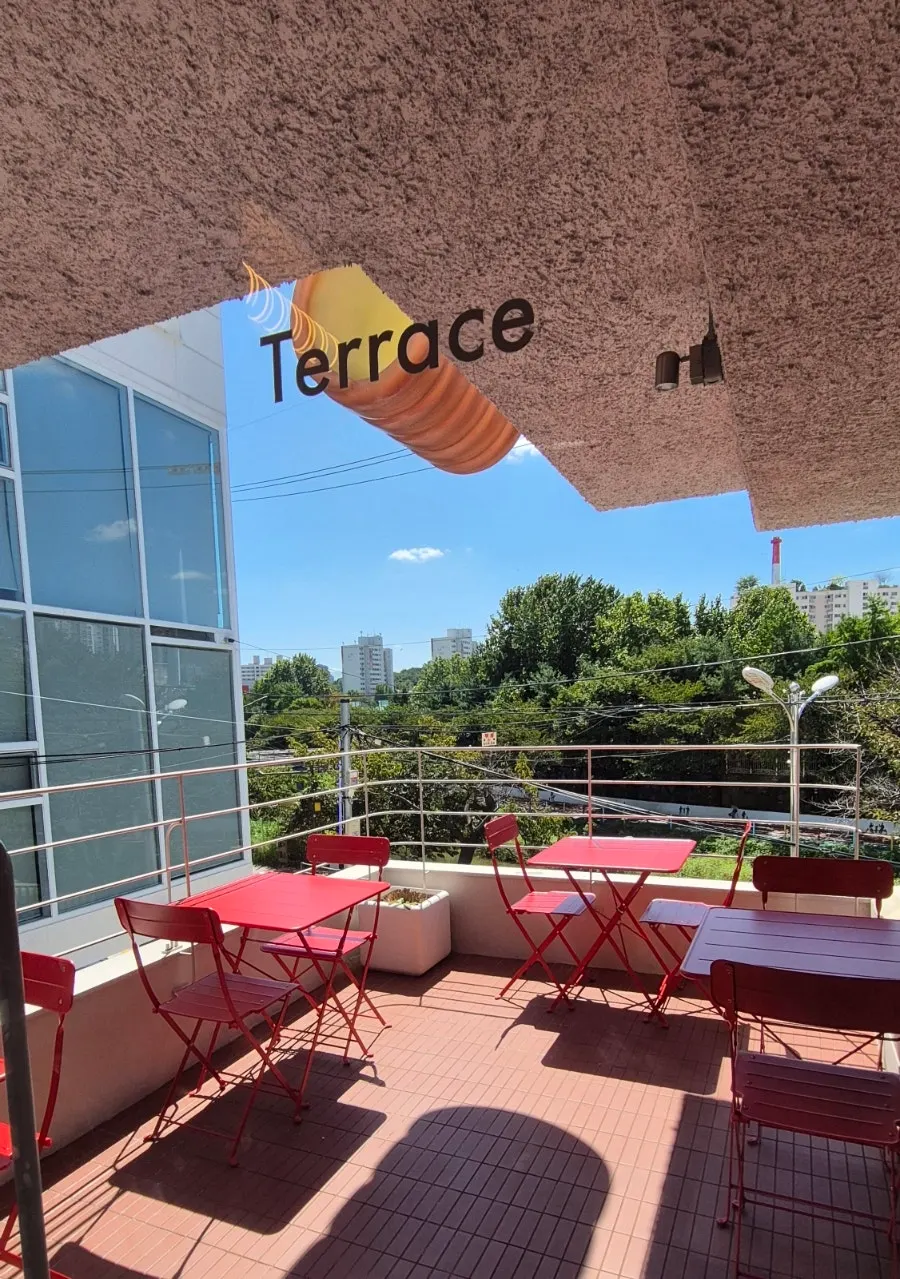 Terrace with red folding tables
