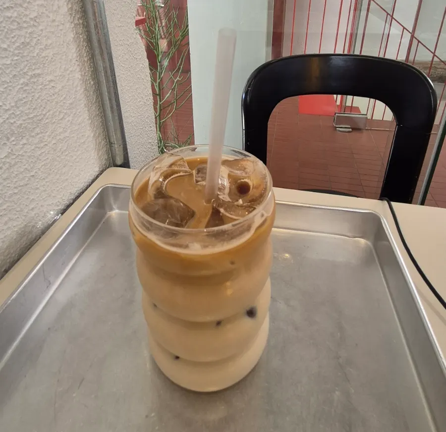 Café latte and café interior