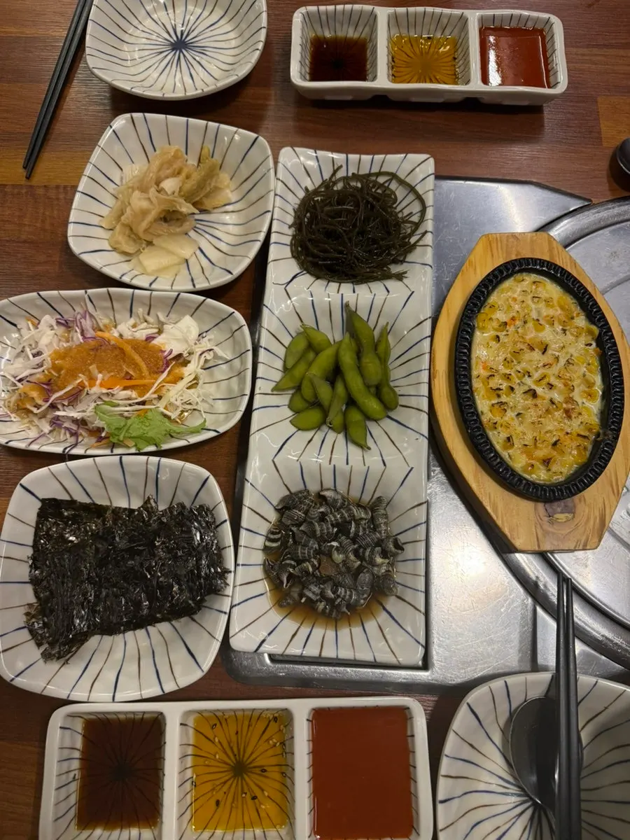 Ordering assorted aged sashimi at the kiosk