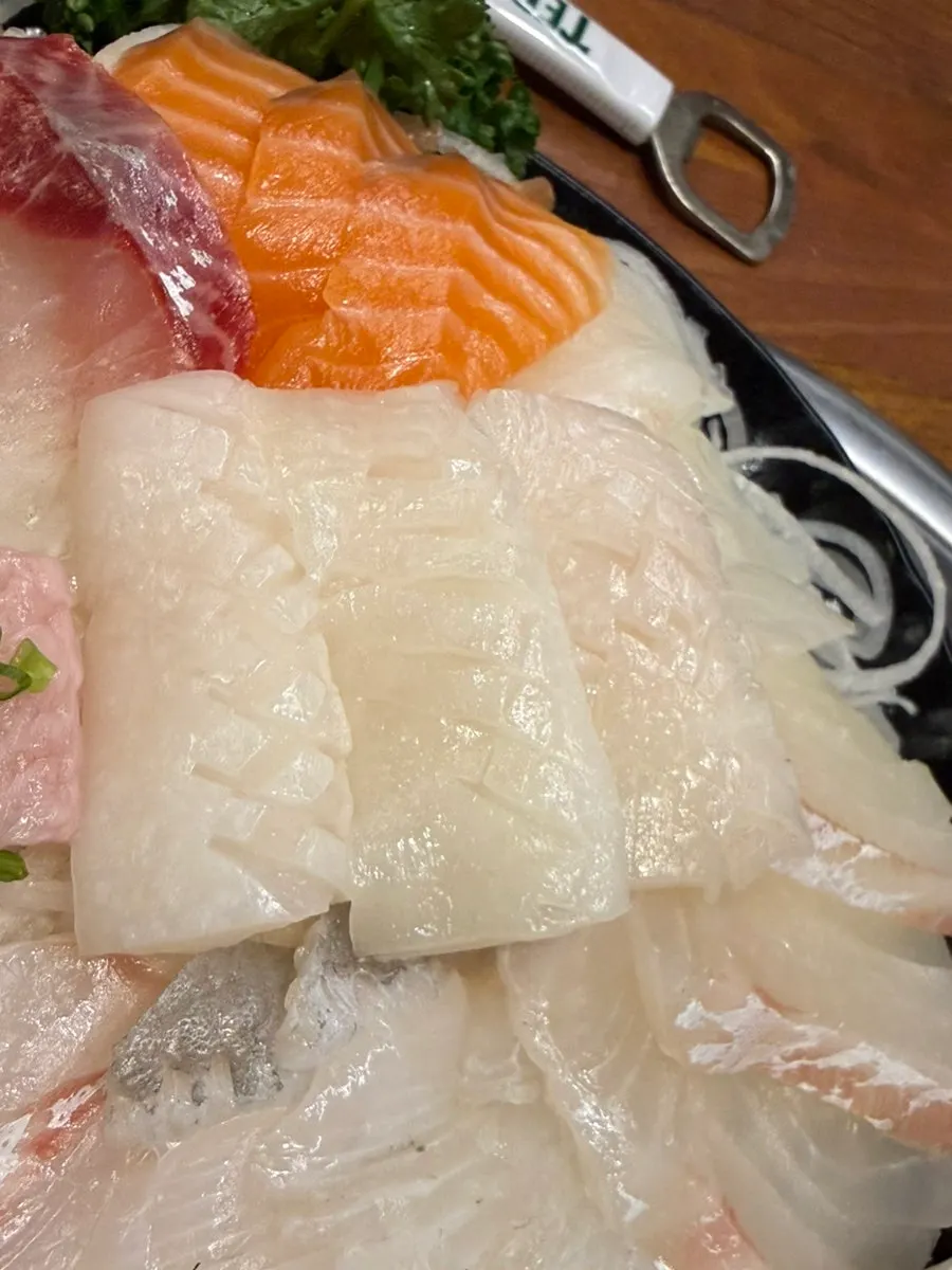 A rich piece of aged herring sashimi