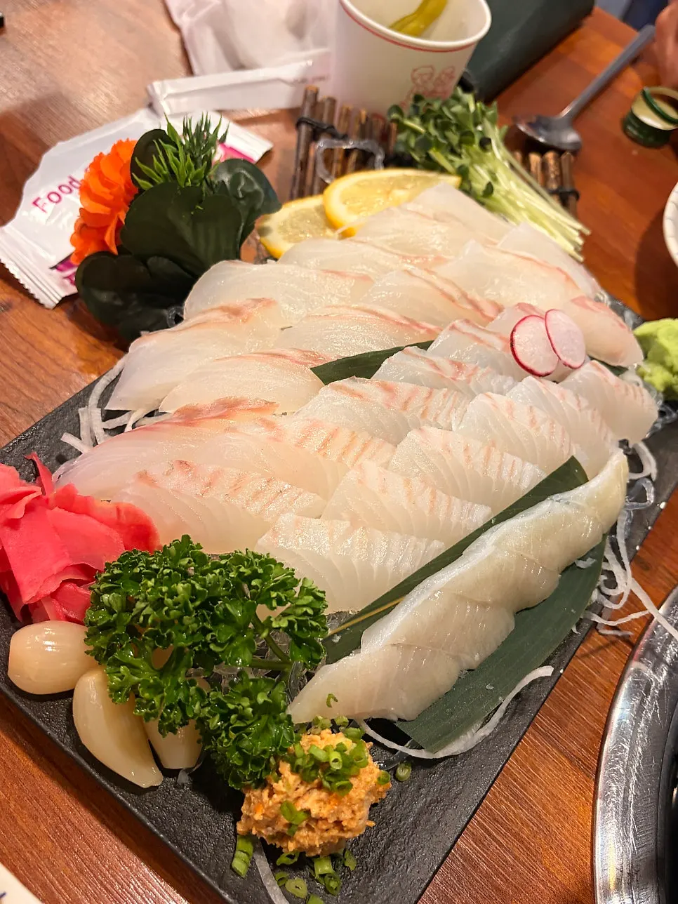A neatly plated dish of daegwangeo sukseonghoe