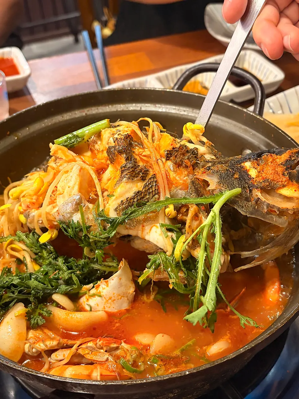 Tongwureok maeuntang made with whole rockfish