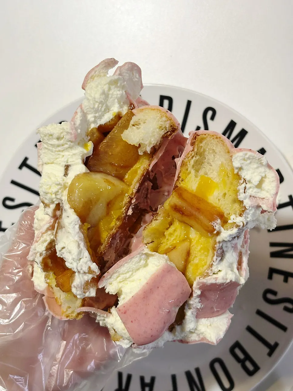 Cross-section of peach wakppu salt bread packed with peach