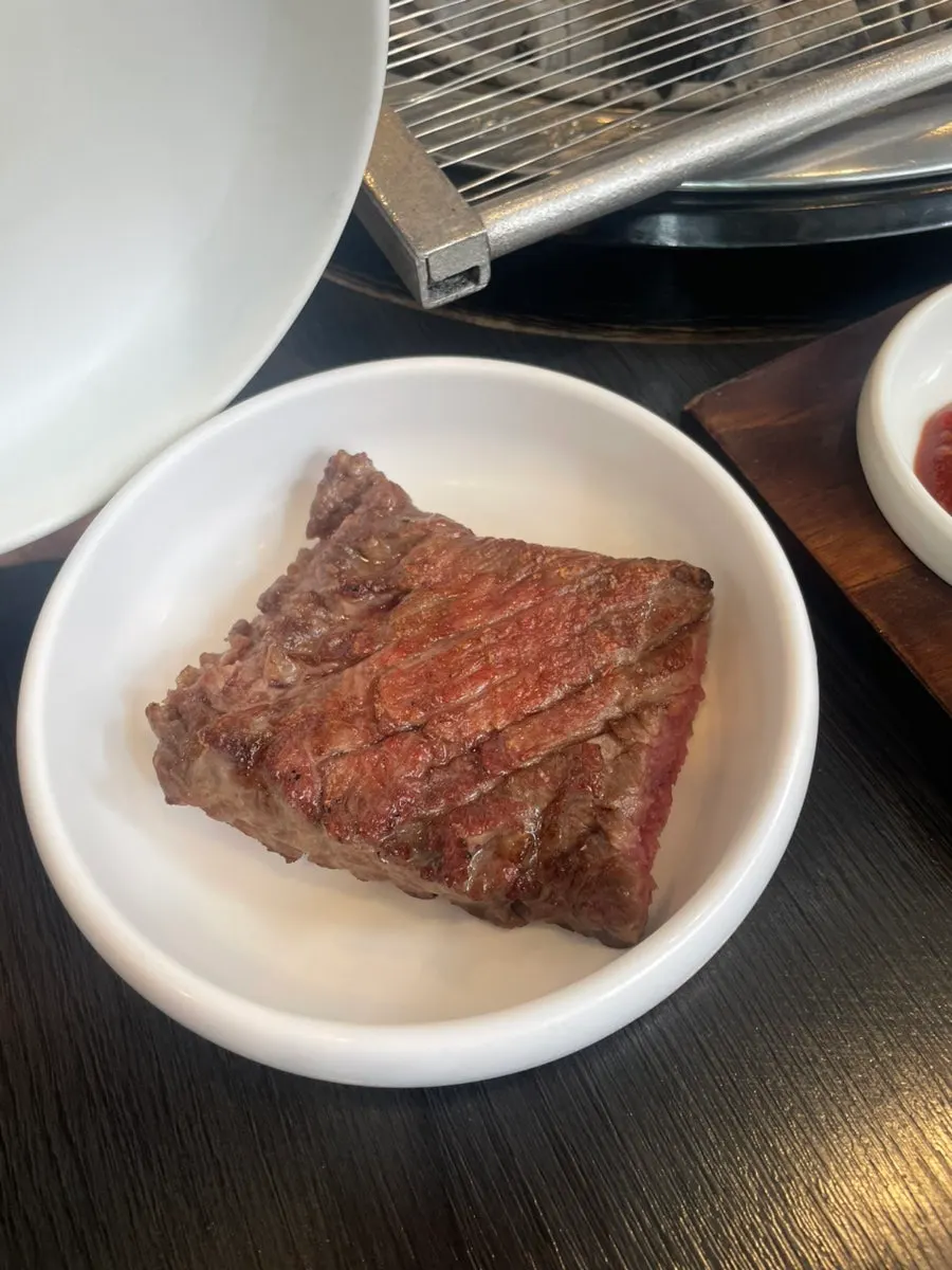 Table setting of Manpo Galbi's 250g raw beef short ribs