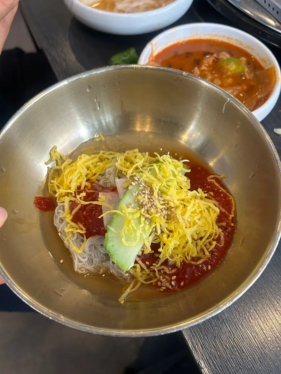 Free house-made naengmyeon served as dessert