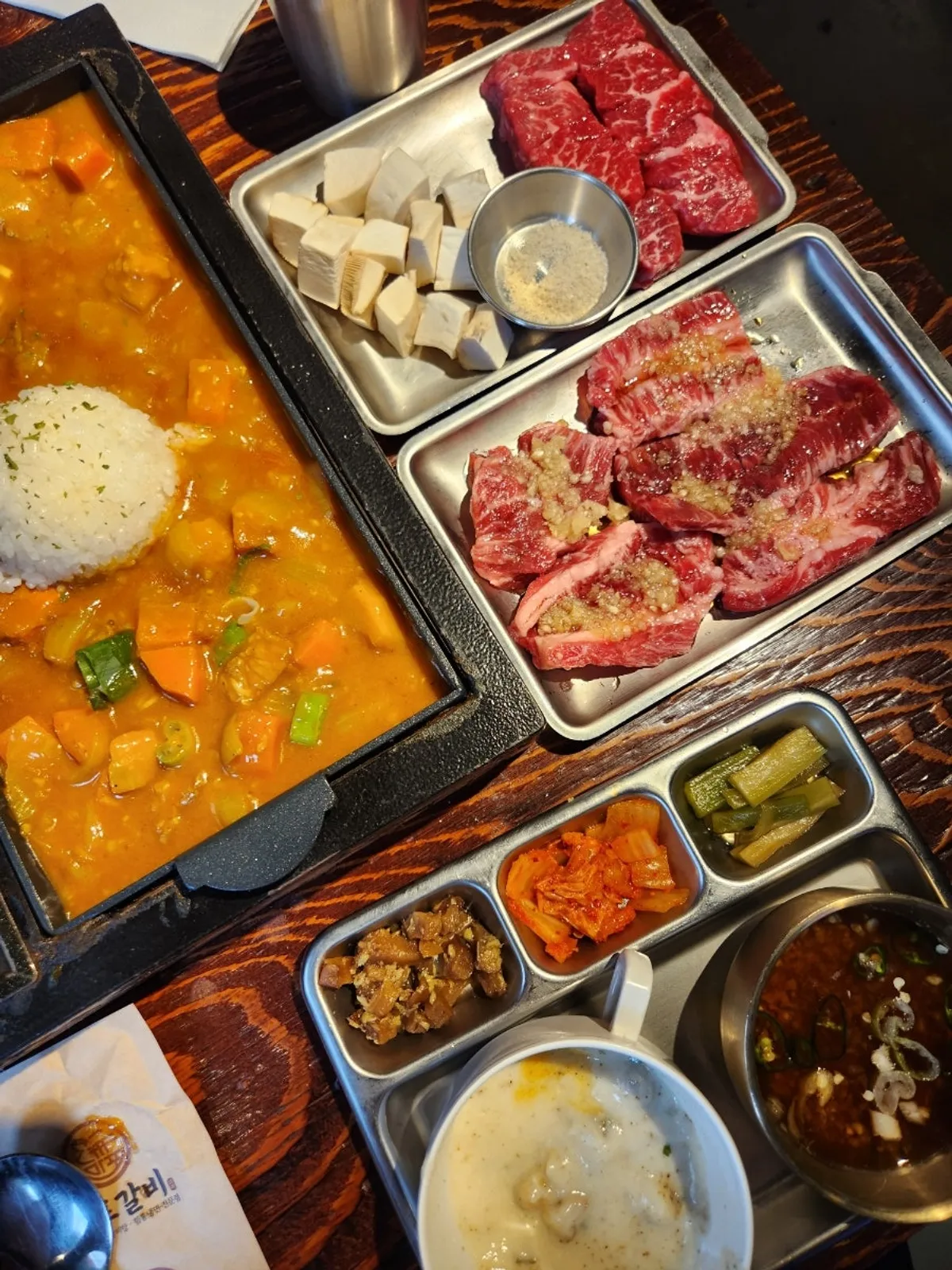 Beef, offal hot pot, and curry meal spread