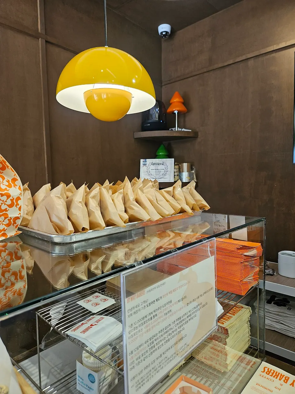 Interior of the store lined with bread and desserts