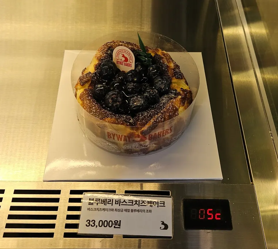Chilled display case with cheesecake and fig pistachio tart