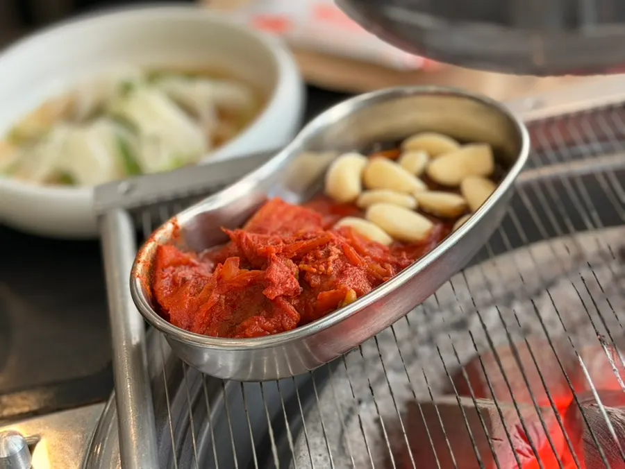 Kimchi, garlic, and pickled onion accompaniments