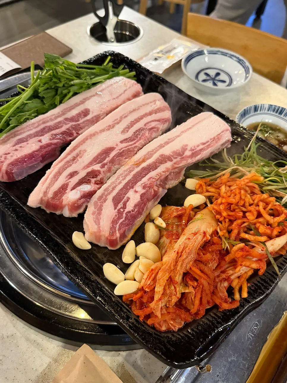 Close-up of pork belly grilling