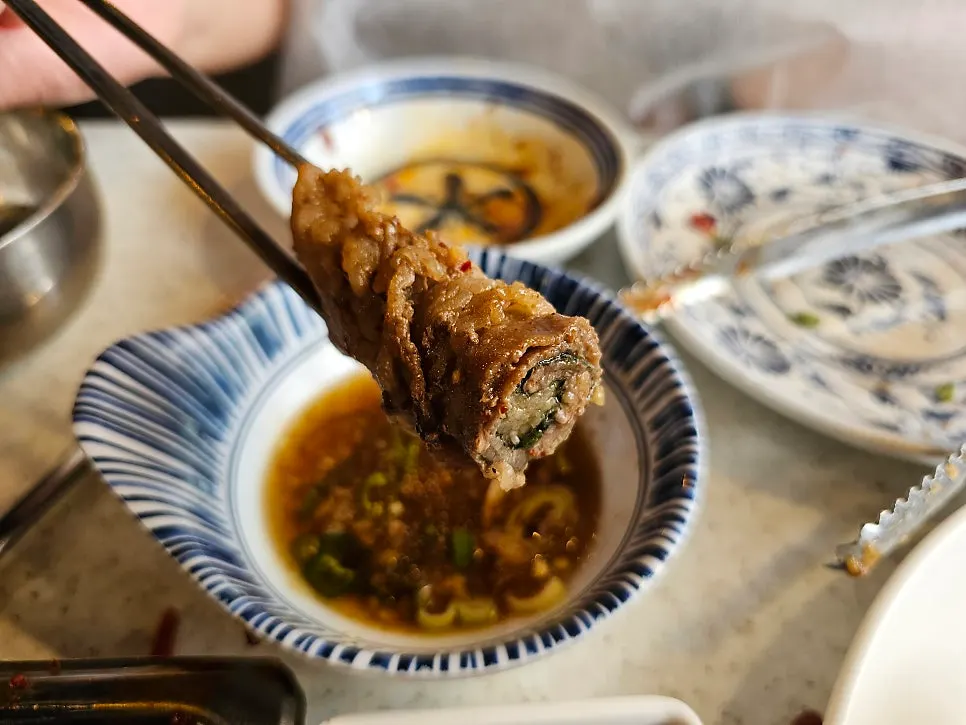 Image of beef rolls served with the special soy sauce