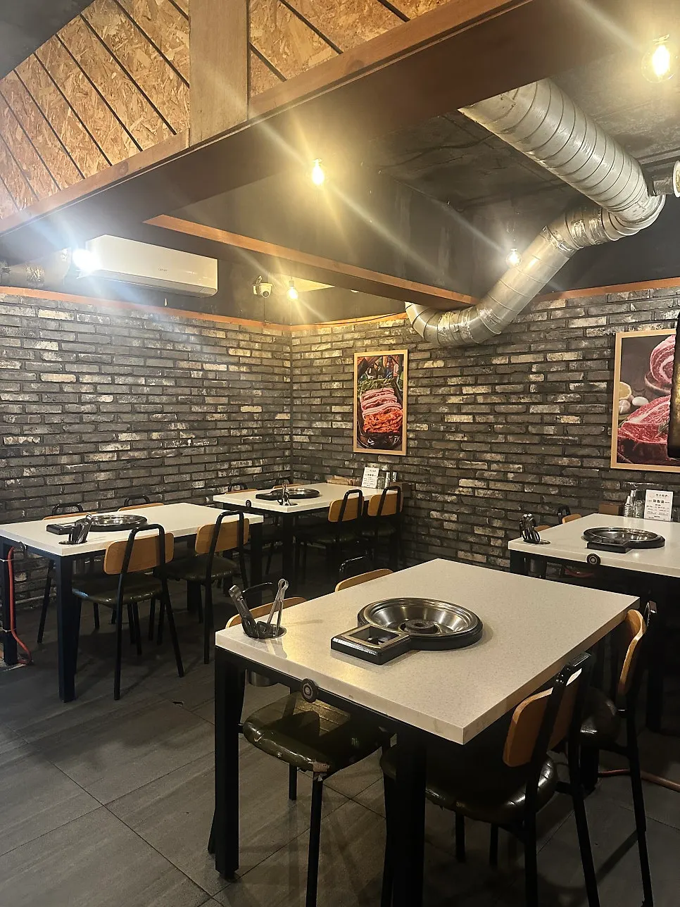 Seating and grill table at Cheonpo Hoegwan Uijeongbu Main Branch