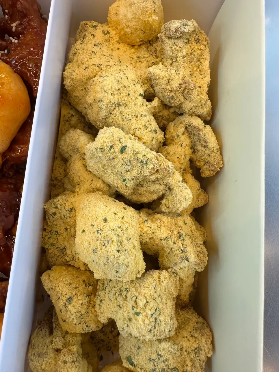 Cheese-seasoned, sweet, and chili-garlic dakgangjeong takeaway
