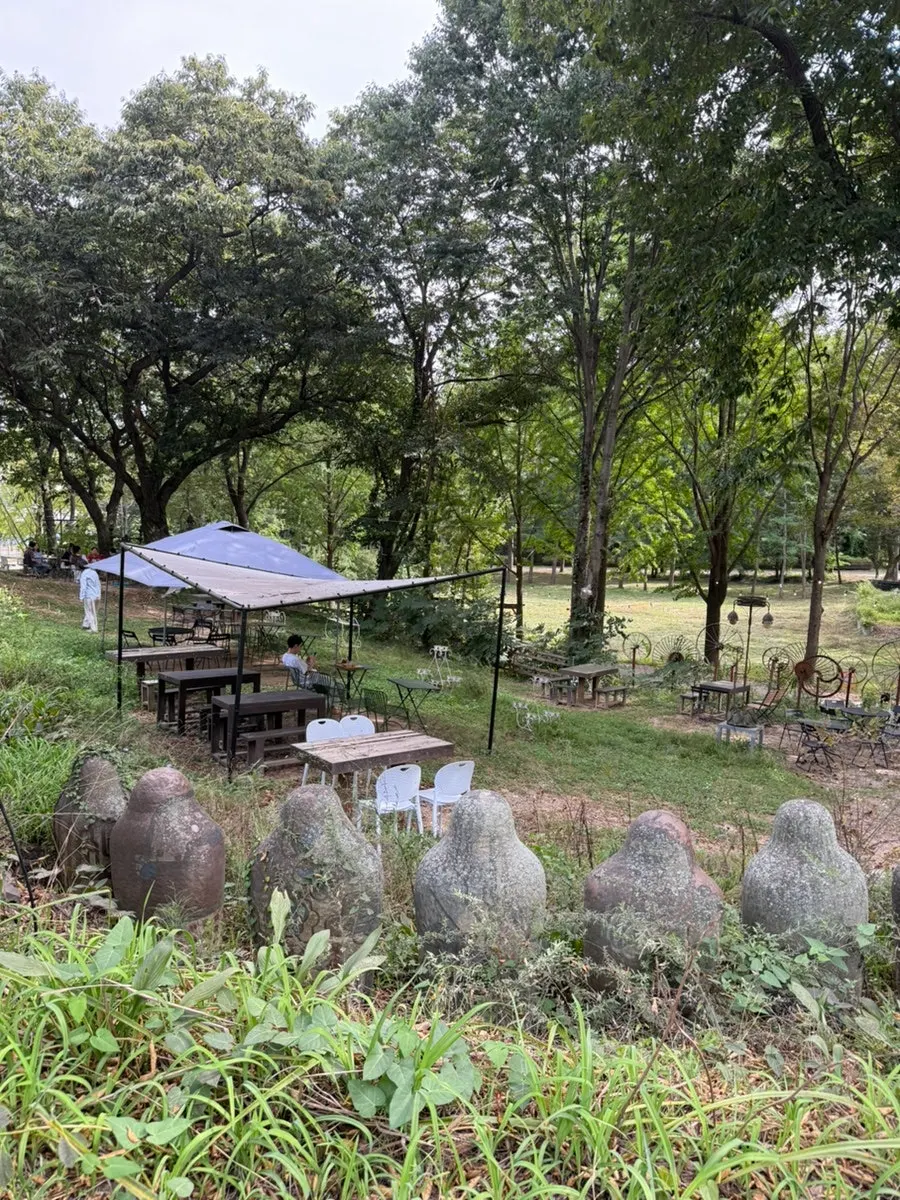 Outdoor table seating surrounded by trees