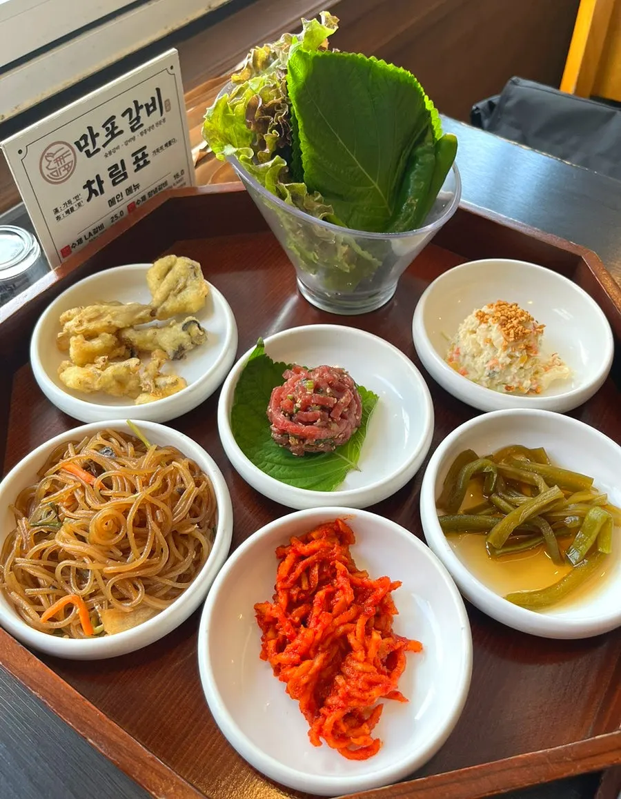Menu signage noting the takeout discount at Manpo Galbi
