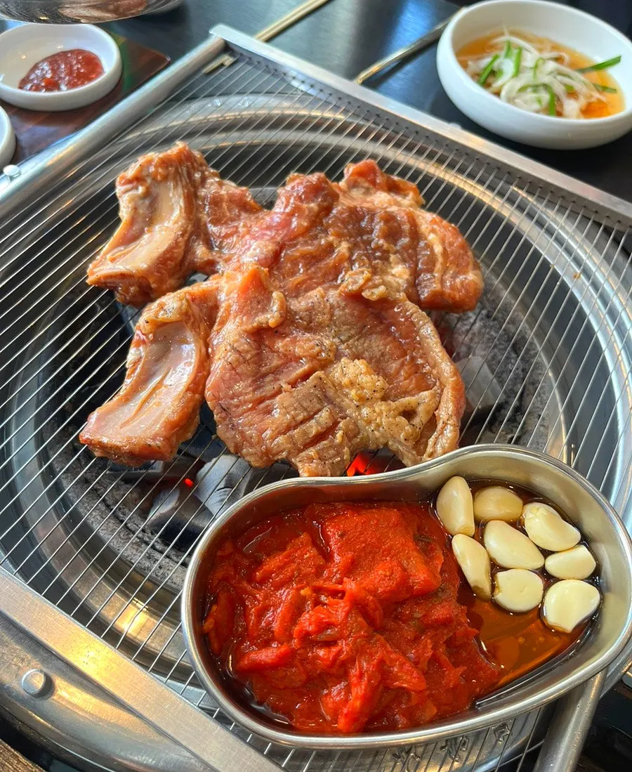 Marinated galbi grilling over charcoal