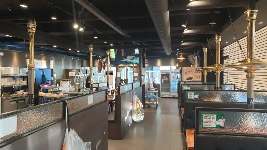 Interior of Korean BBQ restaurant with partitioned tables