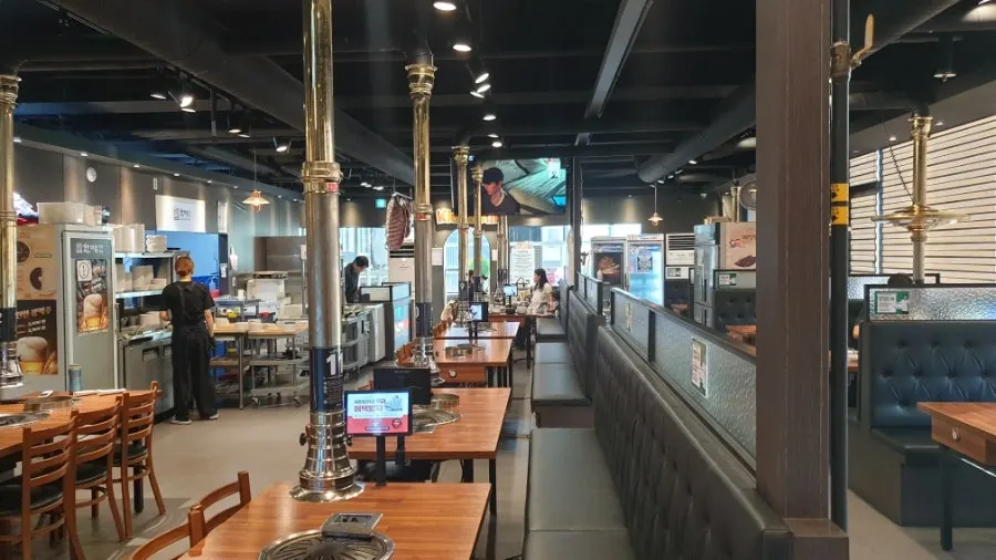 Restaurant interior with wide windows and high ceilings