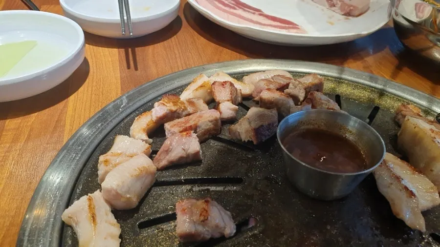 Table with meat and side dishes laid out together