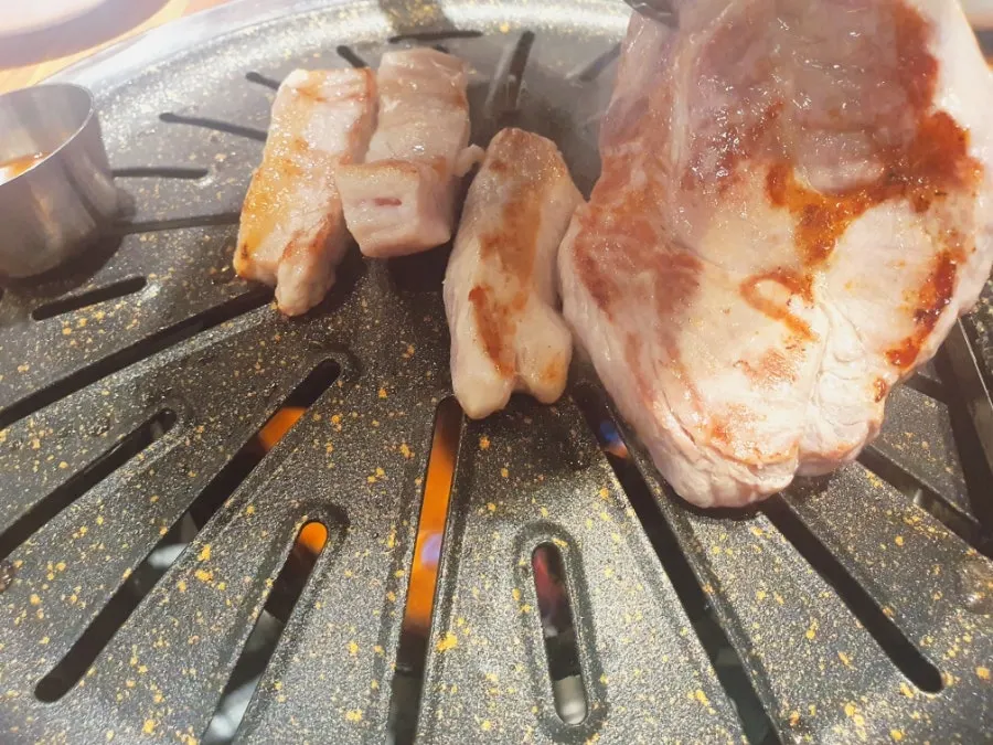 Pork cooking on the grill