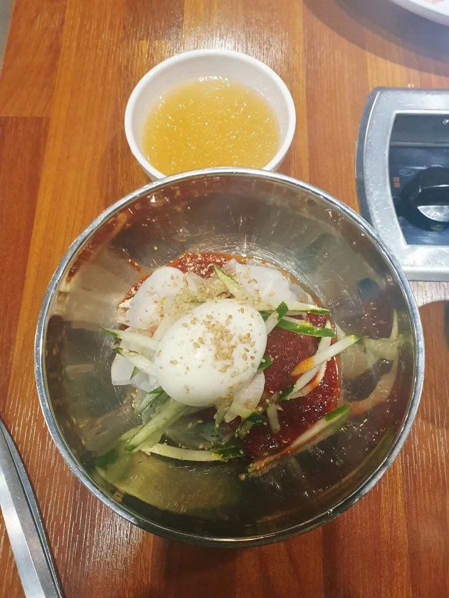Hot doenjang-jjigae simmering at the table
