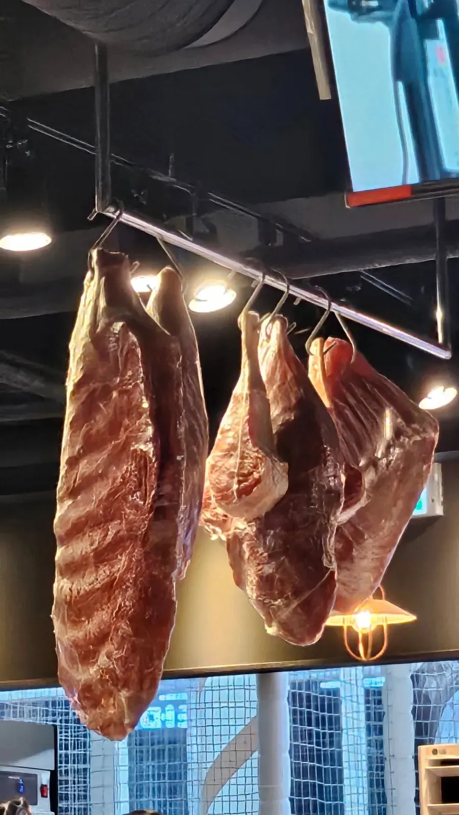 Butcher-shop counter selling in-house aged meat