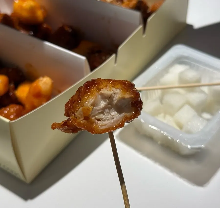Cross-section of crispy dakgangjeong with sauce