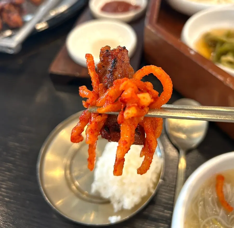 Piece of galbi with ssamjang and mu-saengchae