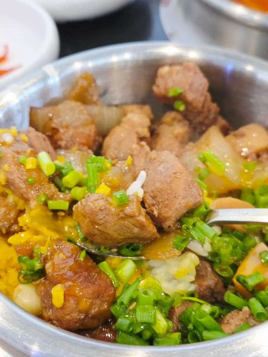 Galbi sotbap topped with egg yolk