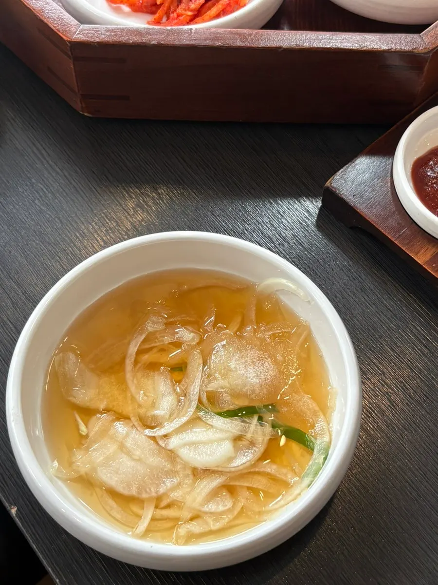 Three servings of handmade marinated galbi on the table