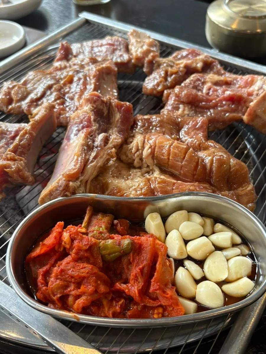 Marinated galbi flipped on the grill