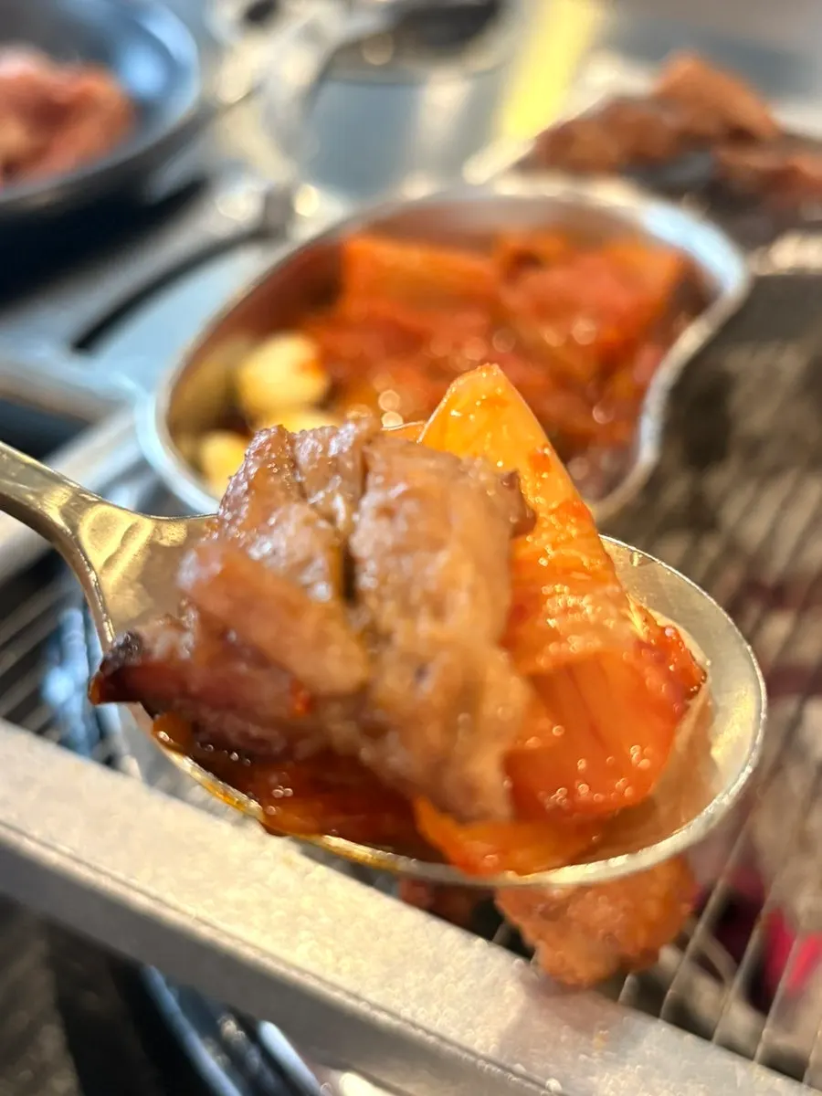 Kimchi cooked on one side of the grill with galbi